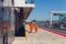 Technical staff male and female in an orange jumpsuit , the clothes are on the inner track