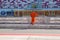 Technical staff male in an orange jumpsuit , the clothes are on the inner track