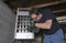 Technician Checking Out A Overhead Gas Furnace