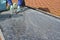 Technician dismounting a damaged solar panel