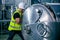 Technician engineer male worker working in boiler room gas pipe checking service routine in industry factory