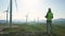 Technician Engineer in Wind Turbine Power Generator Station standing with a tablet in his hands