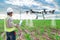 Technician farmer use wifi computer control agriculture drone