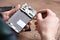 Technician fixing mobile phone at table, closeup.