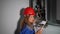 Technician girl inspecting gas boiler heating system with tablet computer