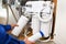 Technician installing reverse osmosis equipment under the sink detail