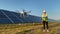 Technician and investor Using Infrared Drone Technology to Inspect Solar Panels and Wind Turbines in Solar cell Farm