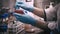 Technician with loop and petri dish in the laboratory / hand of Doctor making a urine culture in a petri dish