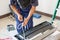 Technician man installing air conditioning in a client house, Young repairman fixing air conditioner unit, Maintenance and