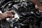 Technician Removing the gasoline injector part in engine room check dust and test pressure