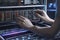 A technician\\\'s hands as they carefully work on a server.