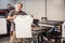 Technician showing empty t-shirt with blank space for insert print