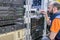 Technician switches the Internet cable of the powerful routers. Specialist connects the wires in the server room of the data