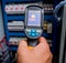 Technician use infrared thermal imaging camera to check temperature at fuse-box