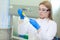 Technician using laboratory pipette and loading samples to a centrifuge machine in a medical or scientific laboratory