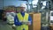 A technician is walking through the plastic-producing facility