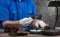 Technician with white gloves digitizing old photography on glass plate