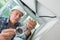 Technician worker installing video surveillance camera on wall