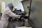 Technician works with analyzer in the blood bank