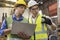 A technician with a wrench and computer laptop. factory workers using machine equipment in workshop. Asian mechanical engineer