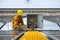 Technician Young Wearing Safety Protective Clothing and Safety Belt to Checking Wiring in Control Panel on Top Roof with Detail in