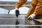 Technician Young Wearing Safety Protective Clothing on Walkway and Using Tool Installing Solar Panel or Photovoltaic at Support