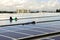 Technicians Arranging Cable Solar Rooftop System