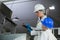 Technicians examining meat processing machine