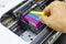 Technicians are install setup the ink cartridge of a inkjet printer the device of office