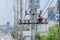 Technicians are repairing high voltage transmission systems on electric  poles