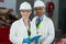 Technicians standing in meat factory