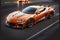 Technologically Advanced Orange Sports Cars in Speeding on the Race Track. AI generated