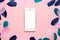 Technology background for mockup with Beautiful abstract pink green and blue feathers and smartphone. Desk for artist, painter.
