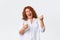 Technology and communcation concept. Portrait of winning happy middle-aged redhead woman rejoicing over awesome news