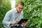 Technology is a handy tool for every researcher and scientist. a handsome young scientist using a digital tablet while