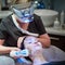 Technology making a more beautiful you. a woman getting a non-invasive face lift at a beauty clinic.