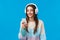 Technology, millennials and lifestyle concept. Carefree cute brunette female student put on headphones, plug-in