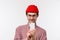 Technology and people concept. Close-up portrait excited handsome bearded man in red beanie and glasses record video on