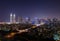 tecom dubai business towers at night lit up