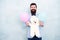 Teddy bear and air balloon. Romantic mood. birthday party surprise. full of happiness. cheerful hipster in jacket and