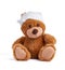 Teddy bear with a bandaged head in a white medical bandage on a white background