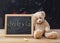 Teddy bear and a blackboard. Dyslexia text drawing on the blackboard