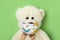 Teddy bear in a children`s protective mask during the Covid-19 coronavirus pandemic