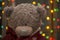 Teddy bear on christmas garland background