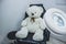 Teddy bear in cosmetic chair, lamp magnifier for beautician , beautician workplace, black chair beauticia