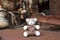 Teddy bear doll in rusting metal machinery