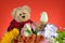 Teddy bear Flower bouquet Red-orange background