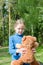 Teddy Bear is a fluffy toy for little cute girl. Best Friends hugging and holding together to go to Picnic