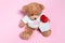 Teddy bear with giftbox and red lollipop in the shape of a kiss of lips. Valentine`s Day