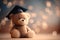 Teddy bear with graduation cap and diploma on bokeh background